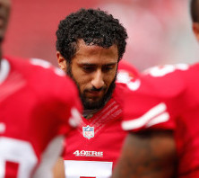 colin-kaepernick-takes-a-stand-by-sitting-during-national-anthem
